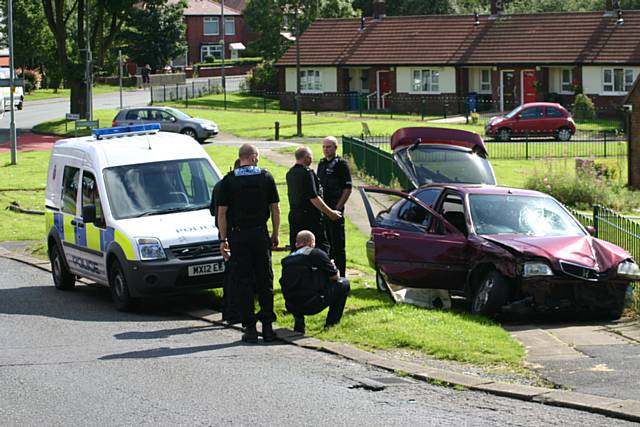 Police chased a red Honda ramming it into a railing on the corner of Red Lane, Buckley Road and Foxholes Road