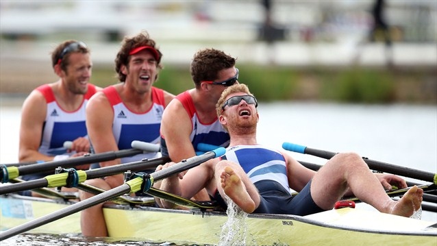 Britain's Stephen Rowbotham, Tom Solesbury, Charles Cousins and Matt Wells react after finishing fifth in the quadruple sculls