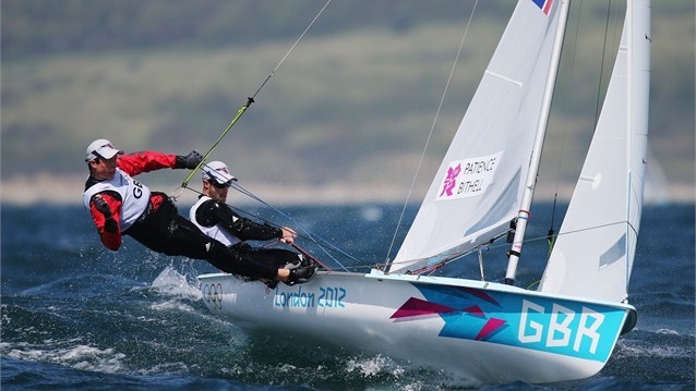 Luke Patience (black) and Stuart Bithell (red) of Great Britain compete in the men's 470 Sailing on Day 6 of the London 2012 Olympic Games at Weymouth & Portland. 