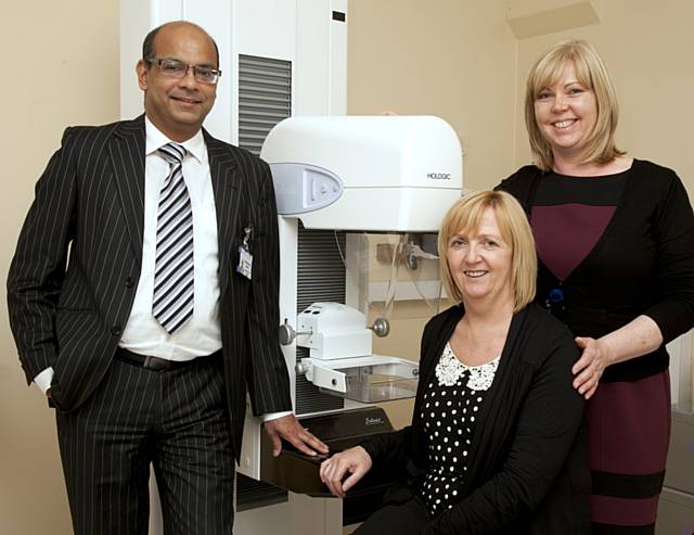 Mr Mohammed Shamim Absar, Clare Brearley, Macmillan advanced nurse practitioner and lead nurse for breast services, and Imelda Hughes (seated), pictured above with a mammogram machine