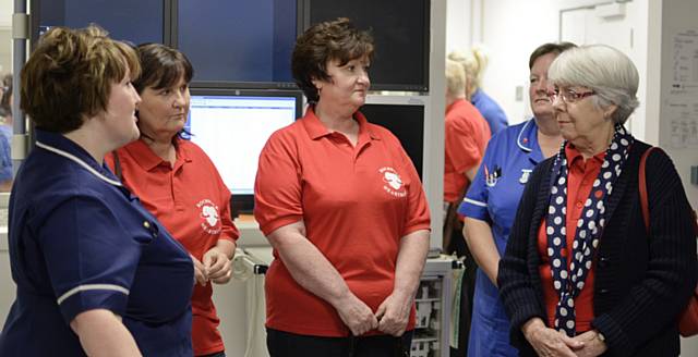 Sister Gill Fogarty, ward manager for the Silver Heart Unit and cardiology ward 2 at Fairfield General Hospital with members of Rochdale Heartbeat