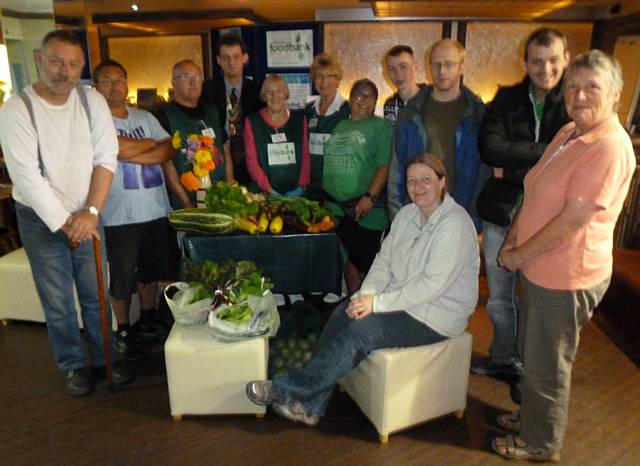 President Neil Helliwell from The Rochdale Rotary Club, volunteers from MIND and Rochdale Foodbank