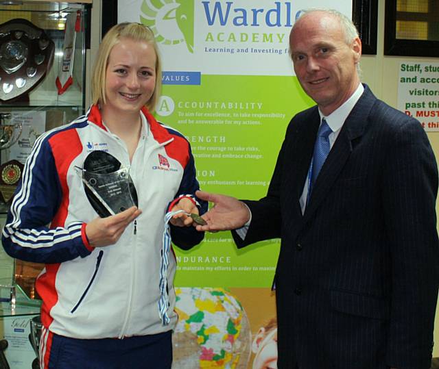 Ruth Walczak, an ex-pupil from Wardle Academy, visits the school to show Dr Graham Wright, Headteacher, her achievements since leaving the school