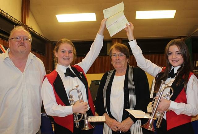 Lynne Brosnan and Andrew Johnson with members of Wardle Youth Brass Band 