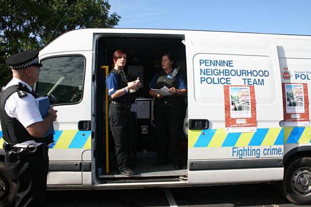 PCSOs give out crime prevention packs to residents from the Police Pod situation at the shops on Albert Royds Street