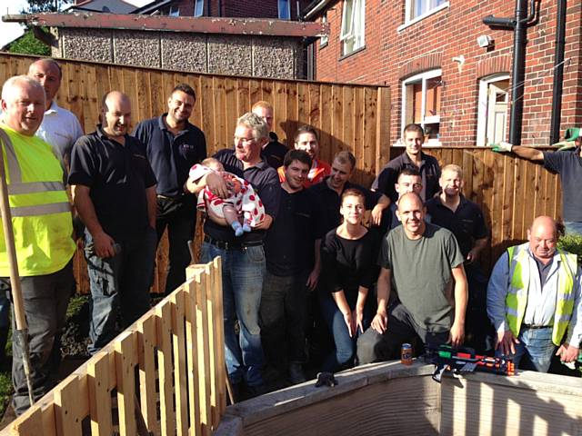 Members of Rochdale Round Table, local family Lisa Bell, Lee Taylor and H Bell and Sons in the garden 