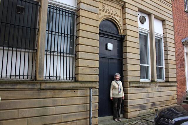 Margaret Royds in front of the old family bank building on The Butts
