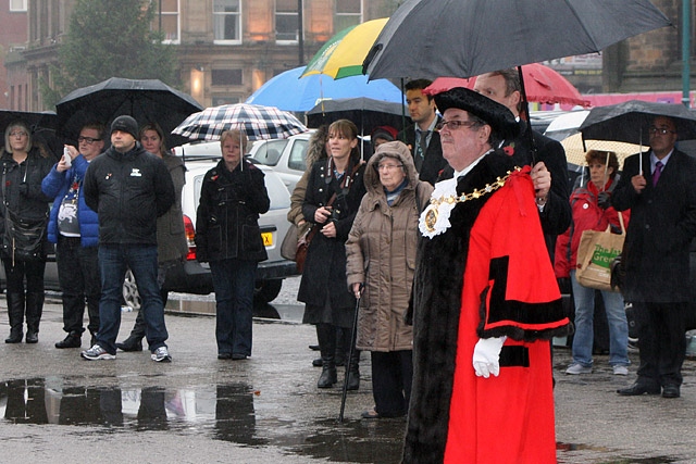 Mayor Peter Rush observes the two minute silence