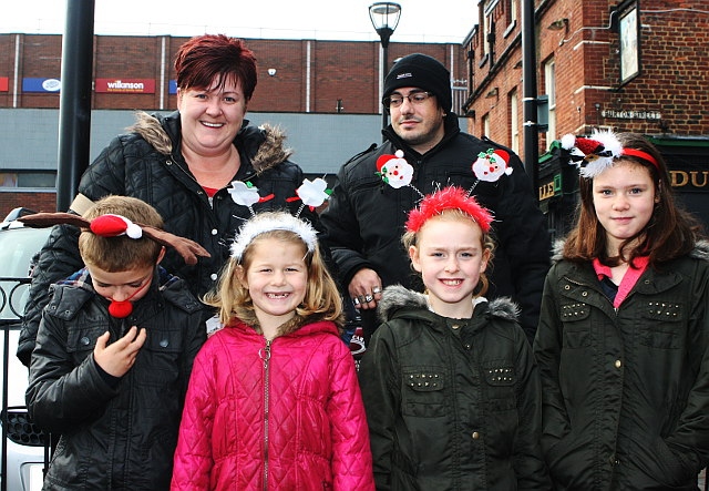 Billy Taylor, Billie Jo Sharp, Amiee Taylor and Katie Taylor enjoy the Middleton Reindeer Parade with family