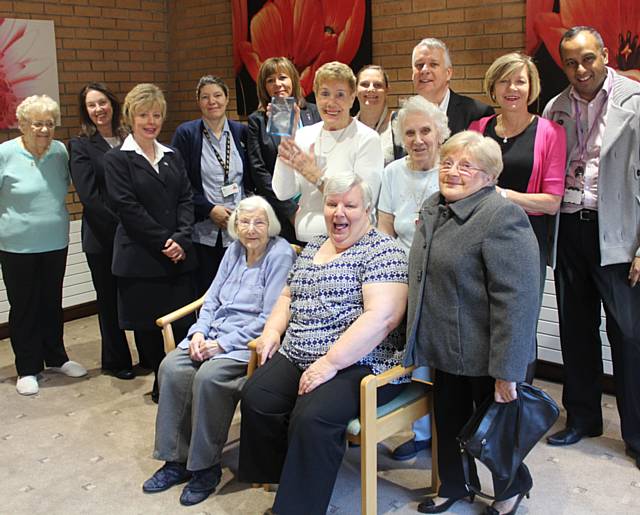 Members of the RBH supported housing team celebrate the award win with tenants at Derrick Walker Court