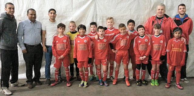 The Shawclough FC Under 10s Thunder team with coaching staff, manager Eugene Warrener, Abdul Hye and Oliur Rahman from Ruchi