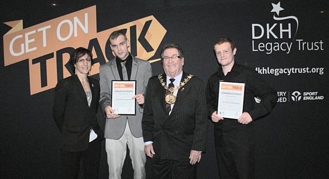 New dads Nick Lawlor and Jordan Hamer-Wynn collect their certificates from the Mayor of Rochdale and local Olympian Sophie Cox