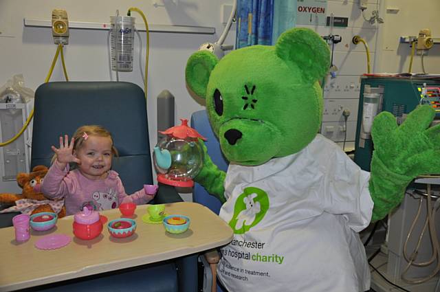 Ella enjoying a tea party with charity mascot, Humphrey