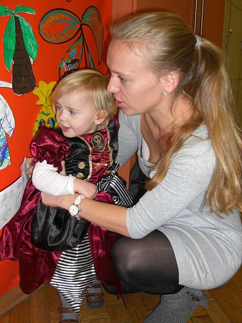 Stephanie Bull and her daughter enjoy making their contribution to the giant Treasure Island Mural
