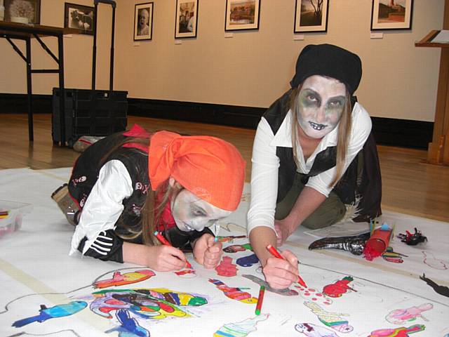 Valerie Corry and son Toby Douglas from Rochdale help complete the Giant Parrot Drawing
