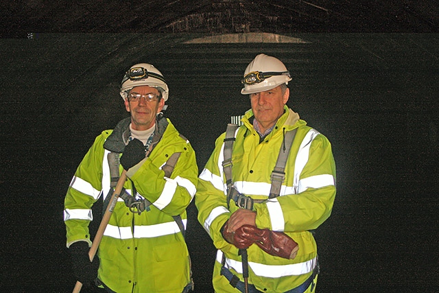 Councillor Colin Lambert and John Percival underground in the River Roch in Rochdale Town Centre