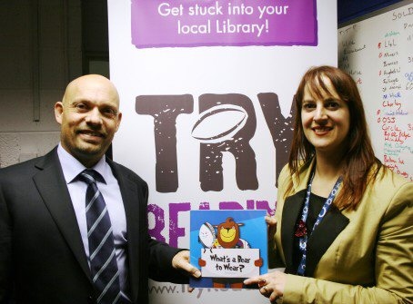 Rochdale Borough Council Deputy Chief Executive Linda Fisher with Rugby League World Cup Referee Phil Bentham, promoting Try Reading, which has raised interest in Rugby League and reading