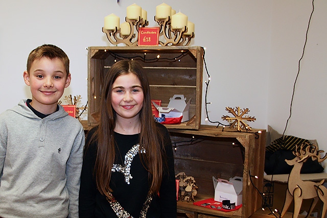 Ewan and Grace Horrocks help at the Matthew Moss pop up shop in Rochdale Emporium