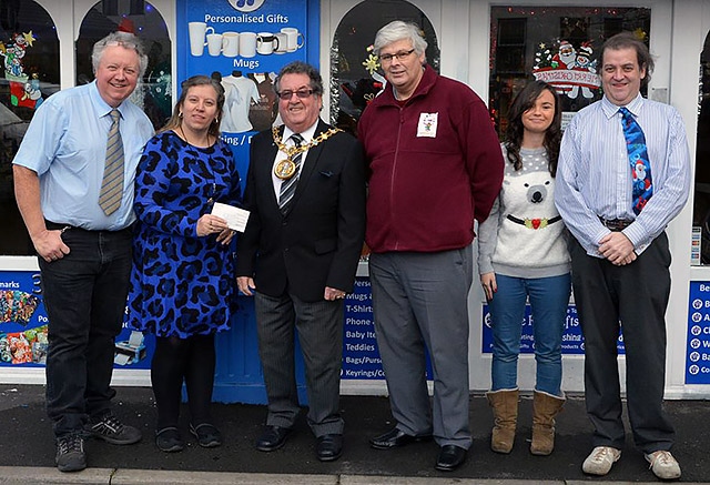 Blue Rose Gifts staff receive their prize from Mayor Peter Rush