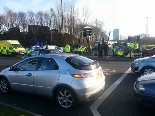 Police car in collision with BMW on Manchester Road at the junction with Roch Valley Way