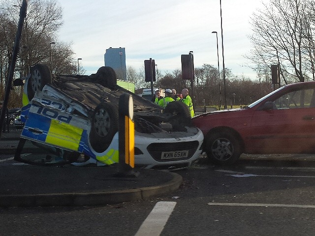 Police car in collision with BMW on Manchester Road at the junction with Roch Valley Way