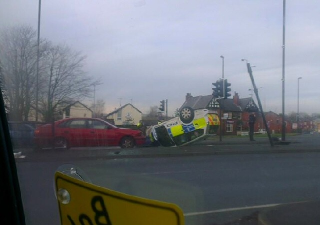 Police car in collision with BMW on Manchester Road at the junction with Roch Valley Way