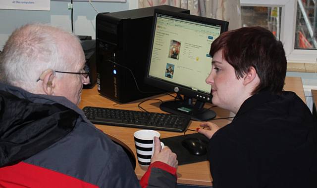 RBH volunteer Mary Gogarty helps Keith Garner get online