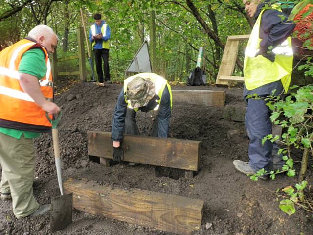 Volunteers laying new steps at Summit Nature Site

