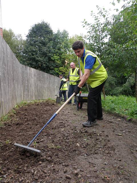 Volunteer trainees tidying paths at Boarshaw Clough Nature Site
