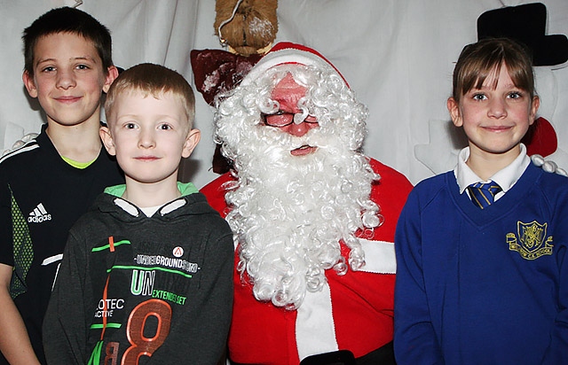 Anthony Hardiker, Tyler Watmoore and Maria Hardiker meet Father Christmas