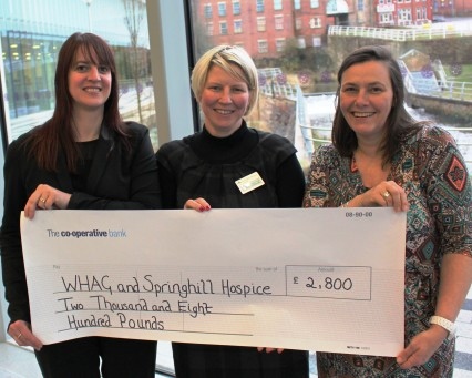 Linda Fisher presents a cheque to Lille Winterbottom from Springhill Hospice and Kirsty Rhodes from Women’s Housing Action 