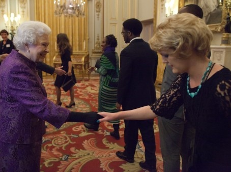 Rochdale Borough Council’s literature development officer Suzanne Heslan meeting the Queen at Buckingham Palace 