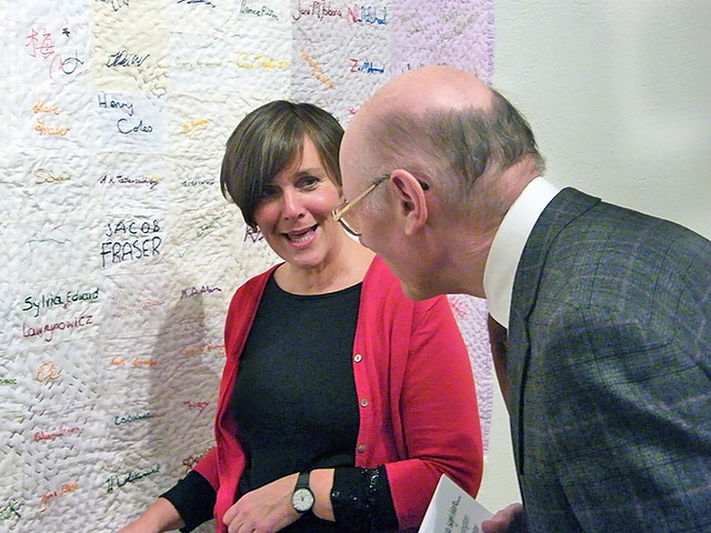 Artist Lynn Setterington with quilt signatory Councillor James Gartside