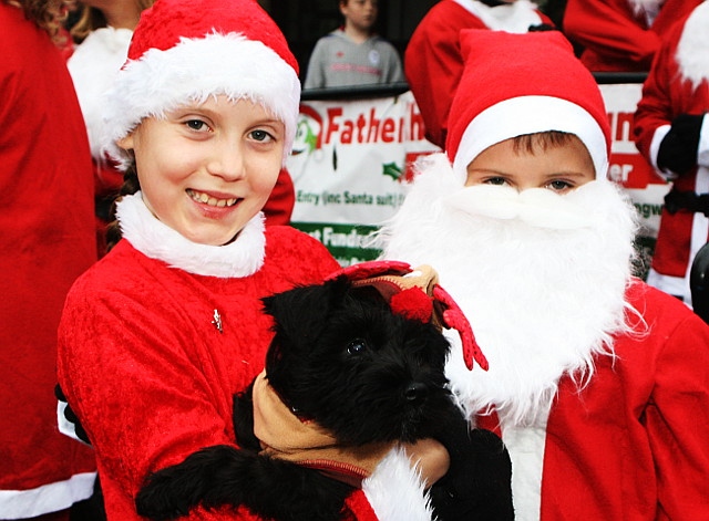 Emelia and Maximus Godley with Kiwi the dog at Springhill Hospice Father Christmas Fun Run