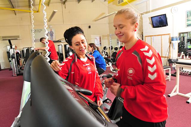 Students Dorothy Matusiqk, right and Abby Marston in the gym