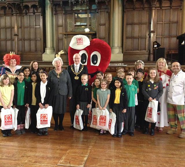 BHF Cardiovascular Specialist Nurses with the Mayor and Mayoress of Rochdale, chef Aazam Ahmad, the Shawclough Primary School Choir and BHF Mascot Mr. Hearty