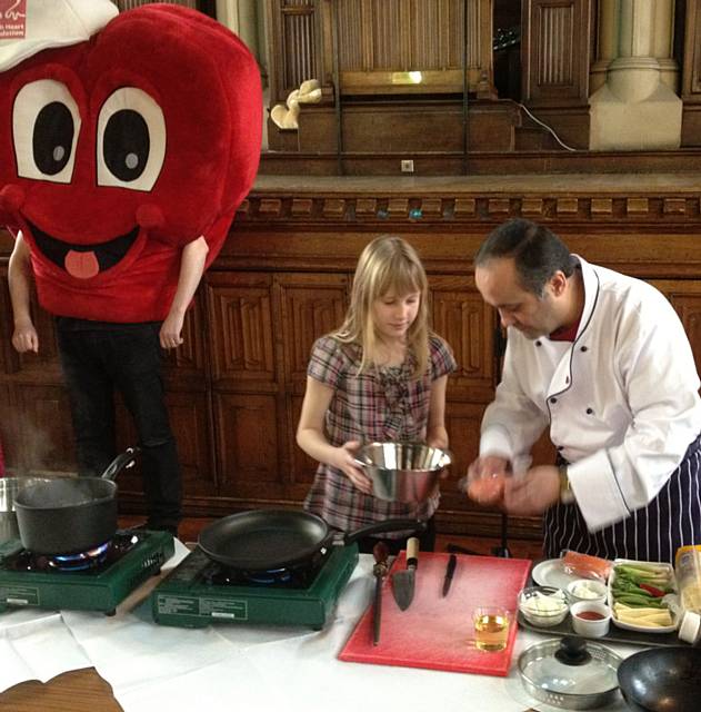 Chef Aazam Ahmad prepares Chili Ginger Salmon on Tagliatelle with the help of the audience at the Red Day Festival