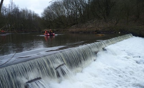 Firefighters faced a fast flowing weir during a joint training exercise