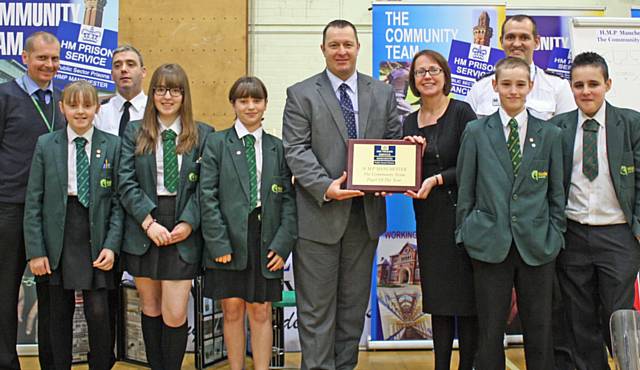 Carole Fisher, Deputy Head Teacher and some of the Year 8 pupils accepting the Community Team Pupil of the Year Award