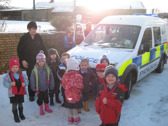 Early Years children with the community police van and their teacher Mrs Oliver