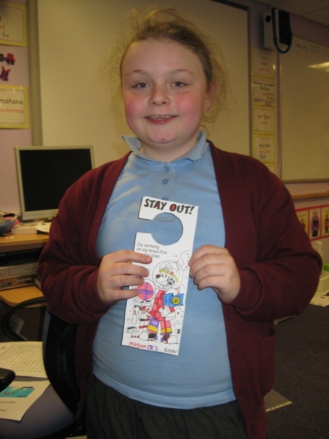 Morgan with her fire safety door hanger