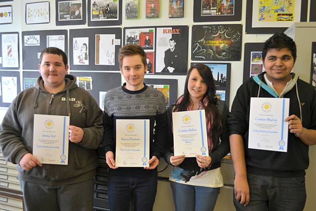 College students who did a work experience placement receiving their certificates. From left to right: James Ord, Reece Freeman, Chelsie Walton and Cheton Mistry