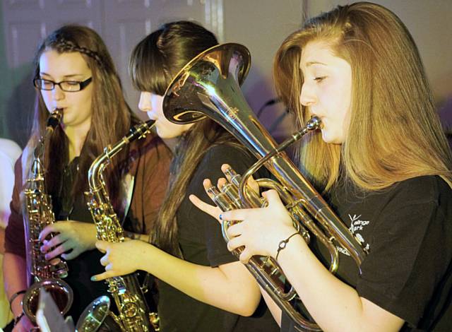 Falinge Park High School music students performing at the 'Dynamite' Music Concert -  Natasha Waddington, Hannah Beech and Abbey Smith in Year 9
