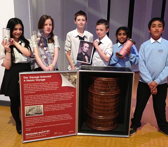 Year 7 learners from Matthew Moss High School with slavery artefacts