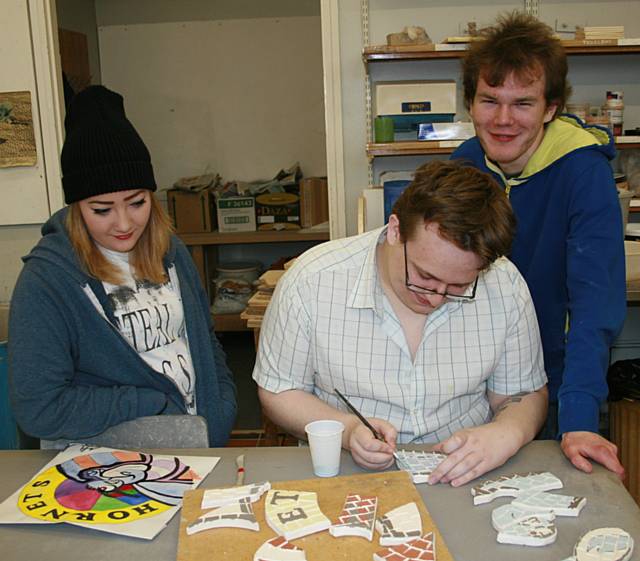 Jeigar Stead, 17, from Littleborough (left), William Vennard, 18, from Rochdale (centre) working on his Rochdale Hornets tile, Christian Hutchins, 21, from Milnrow 