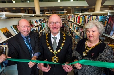 Mayor James Gartside cuts the ribbon to officially open the new library assisted by  Mayoress Jane Gartside and Councillor Peter Williams