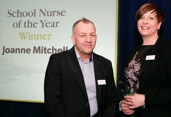 Jo Mitchell receives the School Nurse of the Year award from CPHVA partner Paul Wood of Ten Alps Creative 