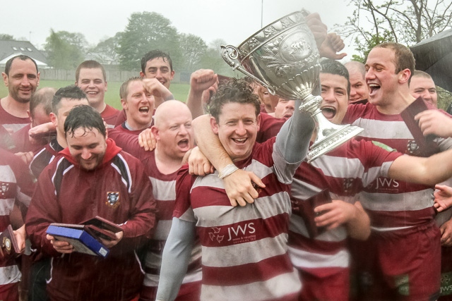 Rochdale RUFC 19-16 Broughton Park<br />Rochdale RUFC Captain Rob Neave lifts the Lancashire Trophy (in the pouring rain!)