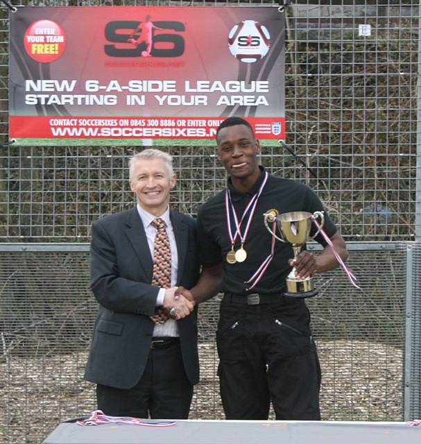 Hopwood Hall College team captain Lloyd Bailey receiving the winners trophy at 2013 Olympiad from John Spindler, Deputy Principal, Hopwood Hall College 