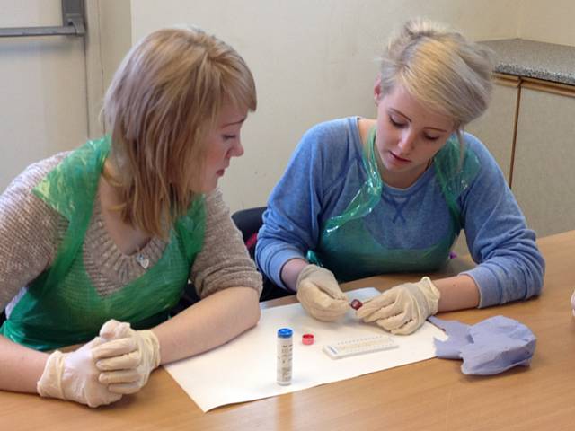 Amy Sutcliffe from Milnrow and Fern Madeley  from Shaw, Oldham, carrying out Packed Cell Volume (PCV) sample preparation and diagnosis